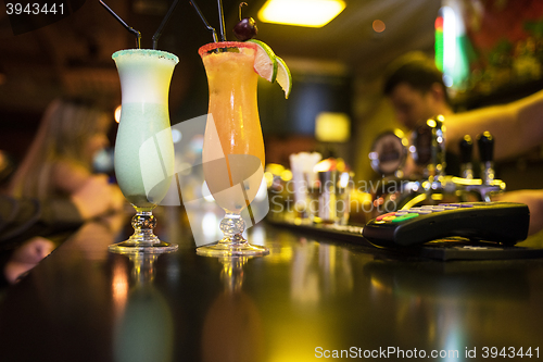 Image of cocktails on bar background