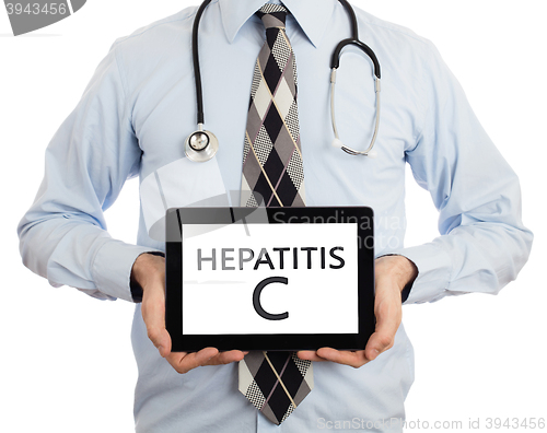 Image of Doctor holding tablet - Hepatitis C