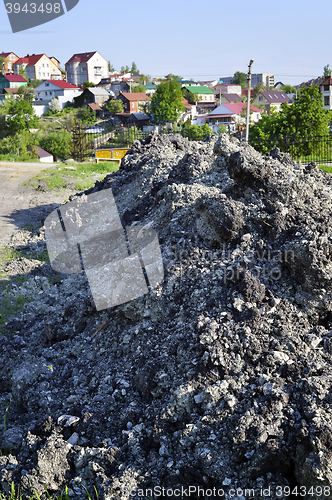 Image of The soil is dumped in a pile during construction work