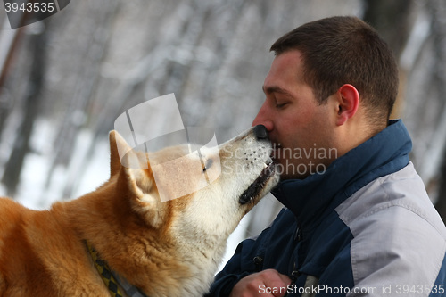 Image of Man with dog and cracker