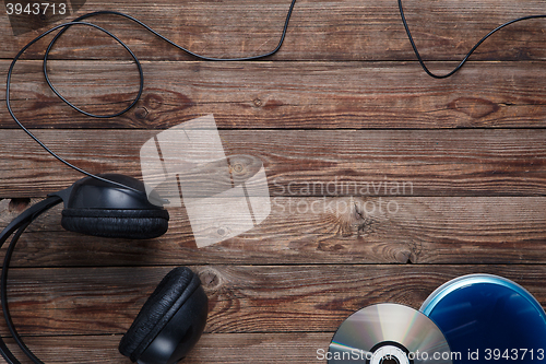 Image of top view of music cd player equipment on wooden desk