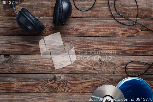 Image of top view of music cd player equipment on wooden desk