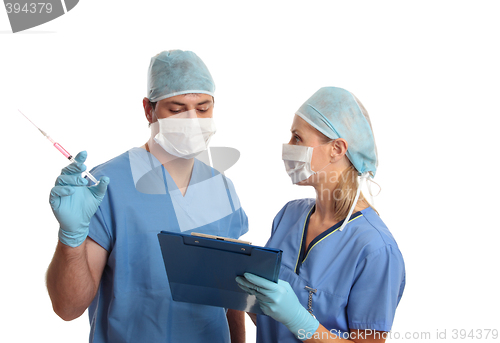 Image of Surgeons consulting talking over medical records
