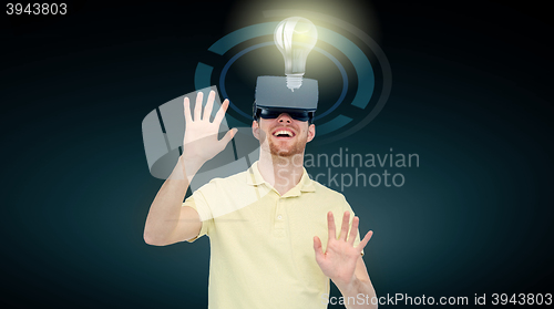 Image of happy man in virtual reality headset or 3d glasses