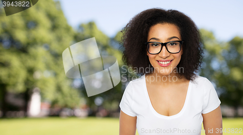 Image of happy african woman or student girl in eyeglasses