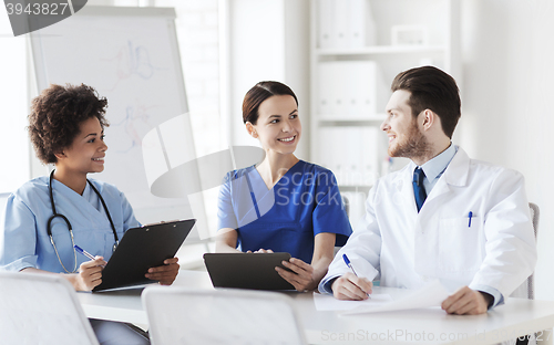 Image of group of happy doctors meeting at hospital office