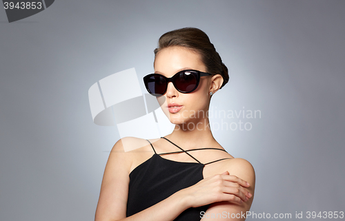 Image of beautiful young woman in elegant black sunglasses