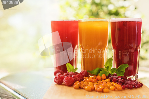 Image of fruit drink with cranberries raspberries and sea buckthorn