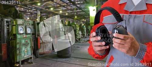 Image of Worker with protective headphone