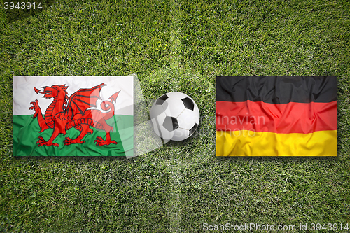 Image of Wales vs. Germany flags on soccer field