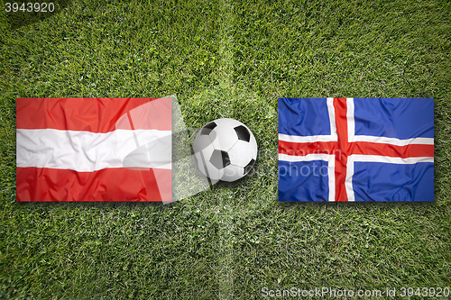 Image of Austria vs. Iceland flags on soccer field