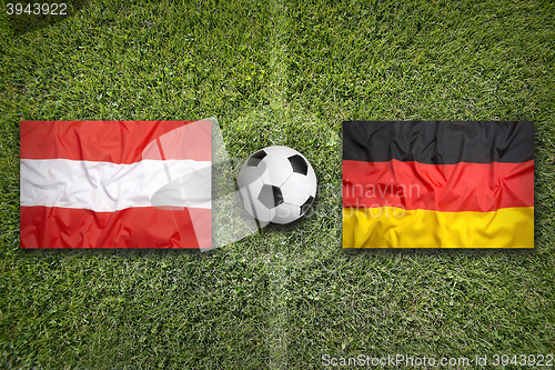 Image of Austria vs. Germany flags on soccer field