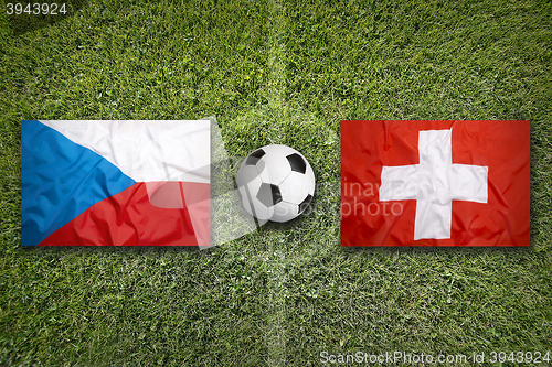 Image of Czech Republic vs. Switzerland flags on soccer field