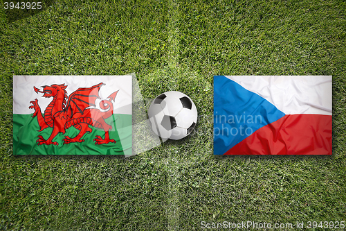 Image of Wales vs. Czech Republic flags on soccer field