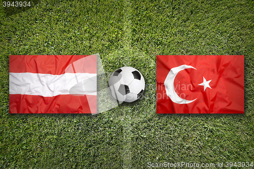 Image of Austria vs. Turkey flags on soccer field