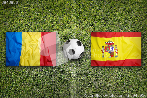 Image of Romania vs. Spain flags on soccer field