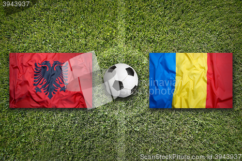 Image of Albania vs. Romania flags on soccer field