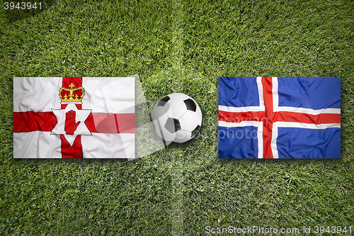 Image of Northern Ireland vs. Iceland flags on soccer field