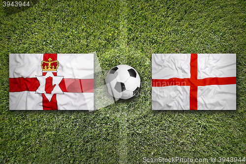 Image of Northern Ireland vs. England flags on soccer field