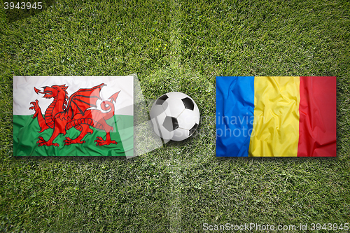 Image of Wales vs. Romania flags on soccer field