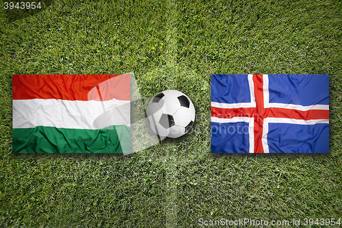 Image of Hungary vs. Iceland flags on soccer field