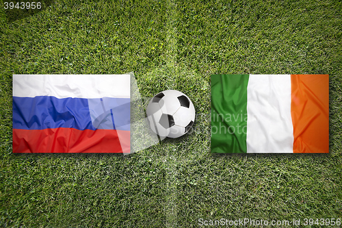 Image of Russia vs. Ireland flags on soccer field