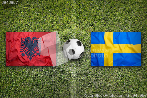 Image of Albania vs. Sweden flags on soccer field