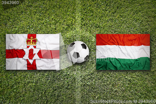 Image of Northern Ireland vs. Hungary flags on soccer field