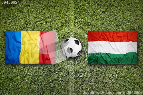 Image of Romania vs. Hungary flags on soccer field
