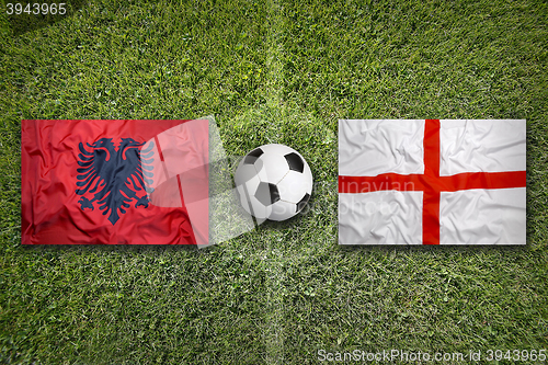 Image of Albania vs. England flags on soccer field