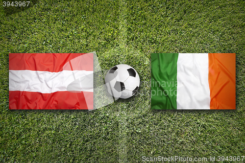 Image of Austria vs. Ireland flags on soccer field