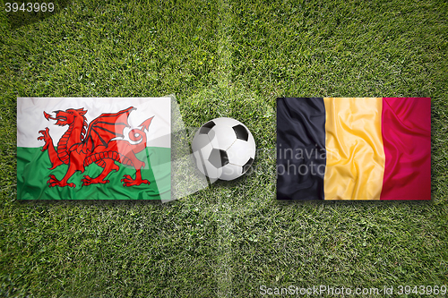 Image of Wales vs. Belgium flags on soccer field