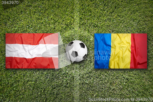 Image of Austria vs. Romania flags on soccer field