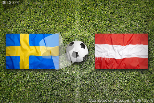 Image of Sweden vs. Austria flags on soccer field