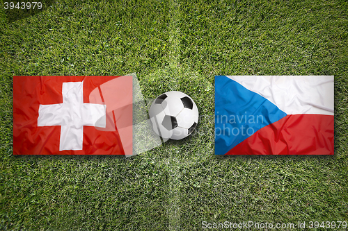 Image of Switzerland vs. Czech Republic flags on soccer field