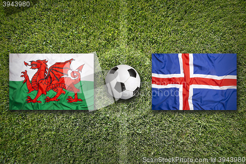 Image of Wales vs. Iceland flags on soccer field