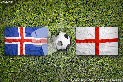 Image of Iceland vs. England flags on soccer field