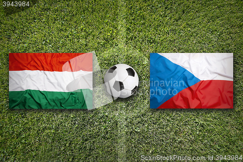 Image of Hungary vs. Czech Republic flags on soccer field