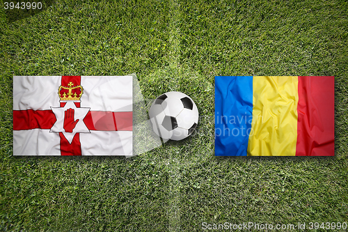 Image of Northern Ireland vs. Romania flags on soccer field