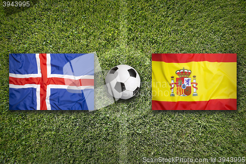 Image of Iceland vs. Spain flags on soccer field