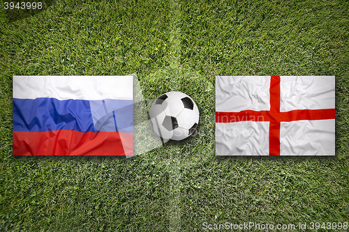 Image of Russia vs. England flags on soccer field