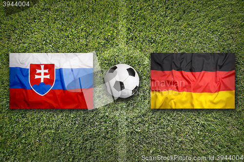 Image of Slovakia vs. Germany flags on soccer field