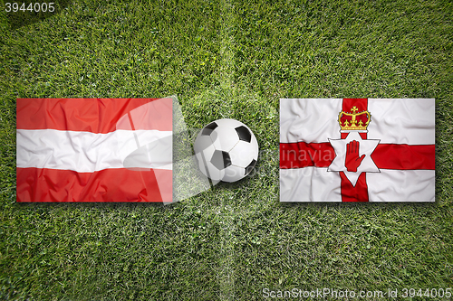 Image of Austria vs. Northern Ireland flags on soccer field