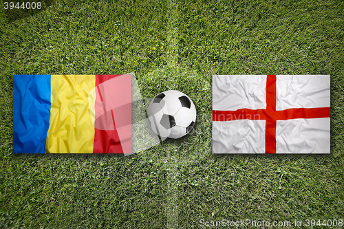 Image of Romania vs. England flags on soccer field
