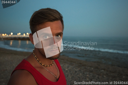 Image of man at the evening sea