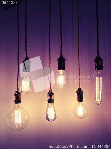 Image of Industrial style light bulbs on purple background