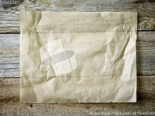 Image of baking paper sheet on wooden table