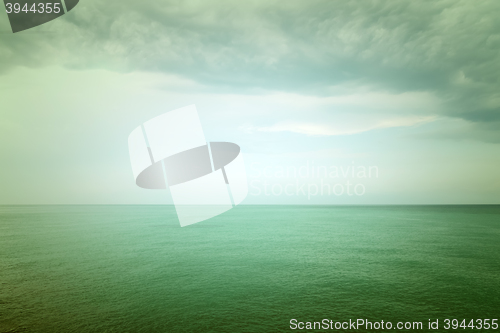 Image of Moody green sea and clouds