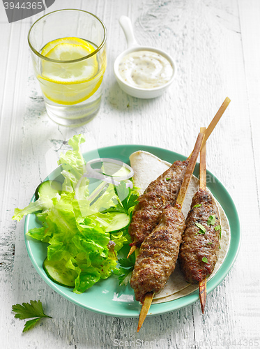 Image of grilled minced meat skewers kebabs