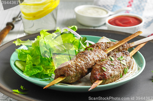 Image of grilled minced meat skewers kebabs